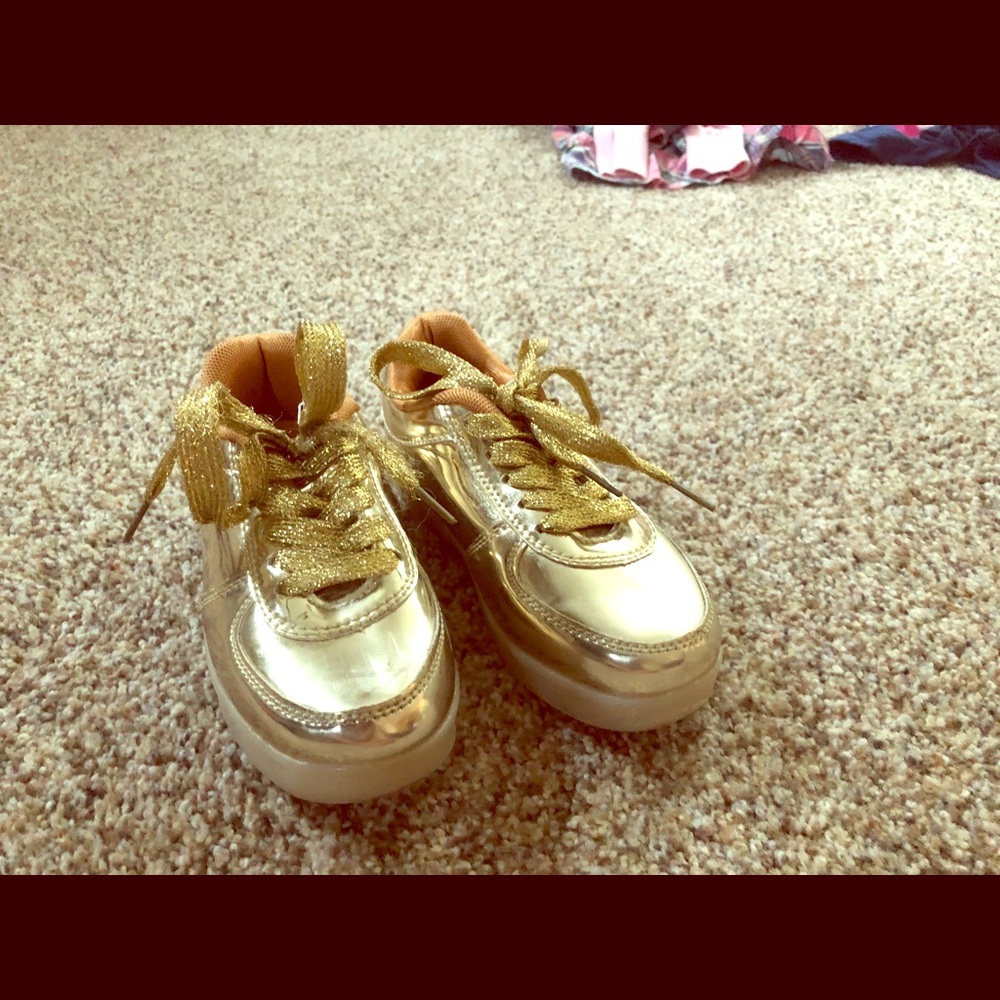 Light up eslla gold sneakers.